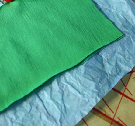 How to Sew Knit Fabric With the Tissue Method by Becky of craftingagreenworld.com