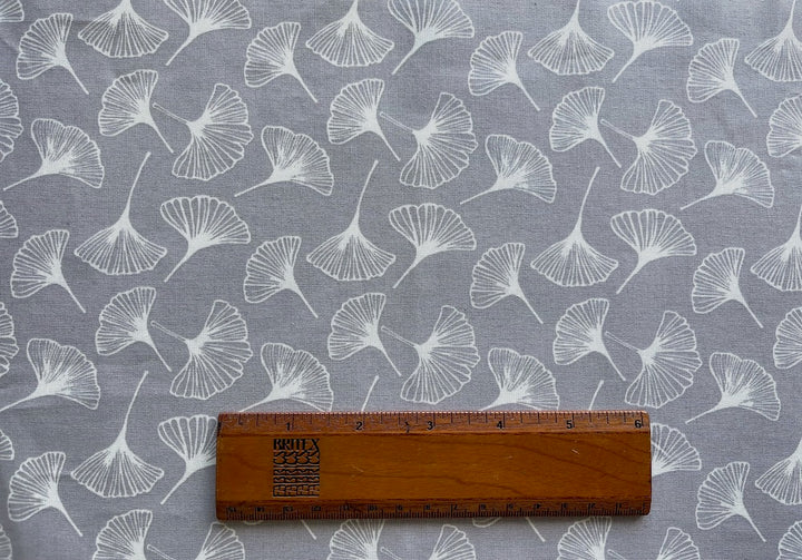 Fluttering White Ginkgo Leaves on Silvery Grey Laminated Cotton (Made in France)